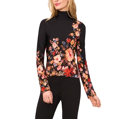 A woman wearing black floral printed turtleneck long sleeve top and black pants