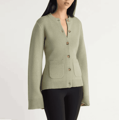 woman wears pistaschio sweater blazer