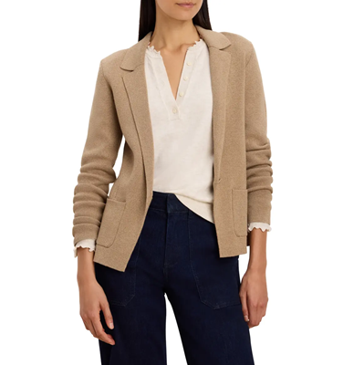 woman wears beige sweater blazer