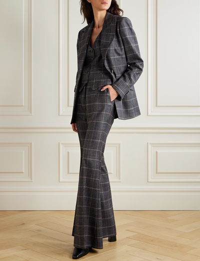woman wears sleek print suit
