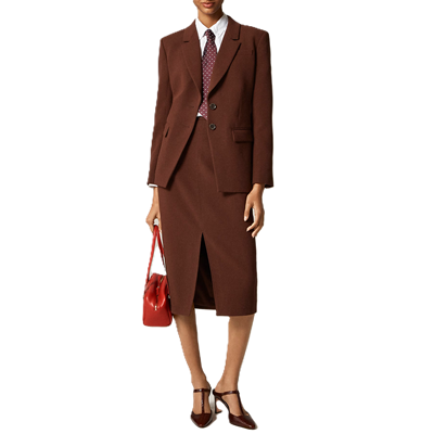 brown skirt suit with longer skirt with slit; model also wears a tie