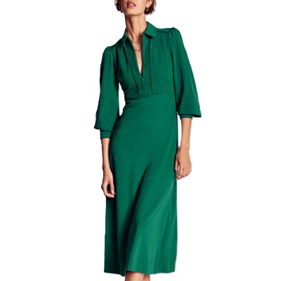 A woman wearing a green midi dress