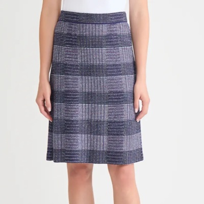 A woman wearing blue checkered pencil cut skirt