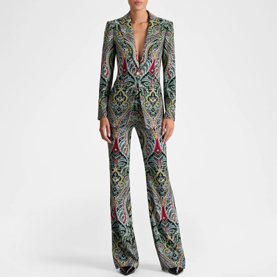 woman wears pantsuit with paisley print