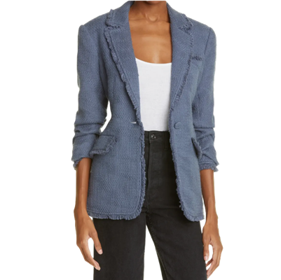 woman wears blue tweed blazer