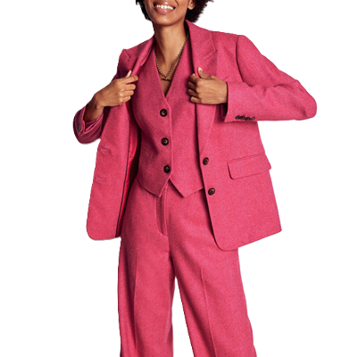 woman wears pink wool suit with matching pink waistcoat