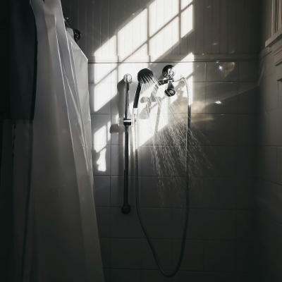 dark home shower stall with light coming in
