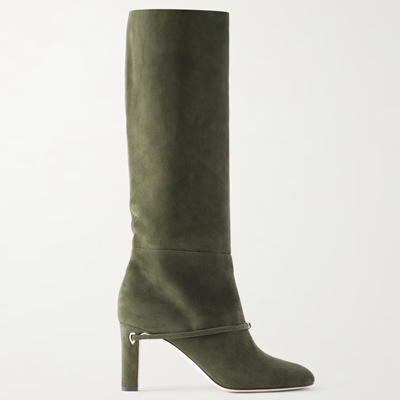 green leather boot with unnecessary but stylish strap running from heel across vamp
