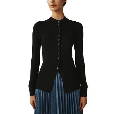 a woman wearing a black buttoned cardigan and blue pleated skirt