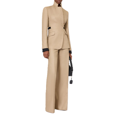 professional Black woman wears beige suit