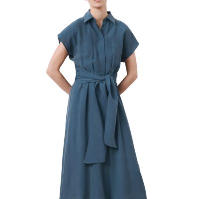 A woman wearing a medium-blue shirtdress