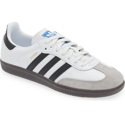 white sneakers with black stripes and gray toe