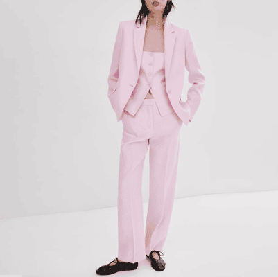 pink linen suit with black mary jane flats