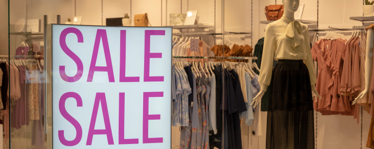 storefront with large SALE SALE sign