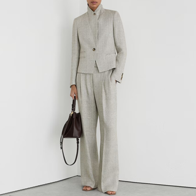 herringbone light gray suit with a shortish jacket