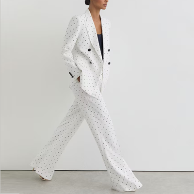 white suit with navy polka dots