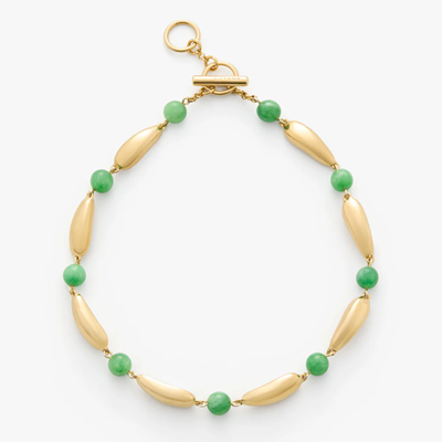 golden necklace with green beads