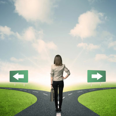 businesswoman stands at a crossroads and must make a decision