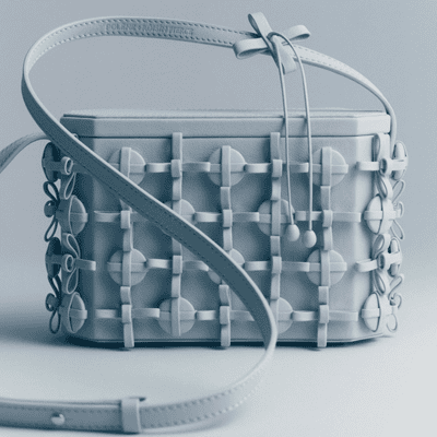 unusual blue boxy bag with a lot of details on the exterior of the box