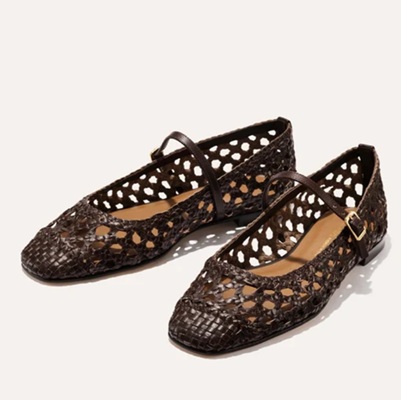 A pair of brown woven leather flats