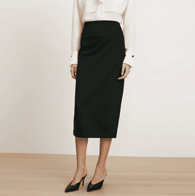 woman wears black midi pencil skirt
