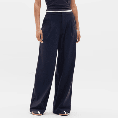 woman wears stylish wide leg pants for work