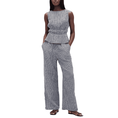 woman wears doublecloth gauze peplum blouse and matching pants
