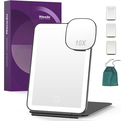 travel media arrives in purple box and has a green pouch for carrying; the product image shows different lighting possibilities as well as the fact that there's a smaller mirror that magnifies 10x