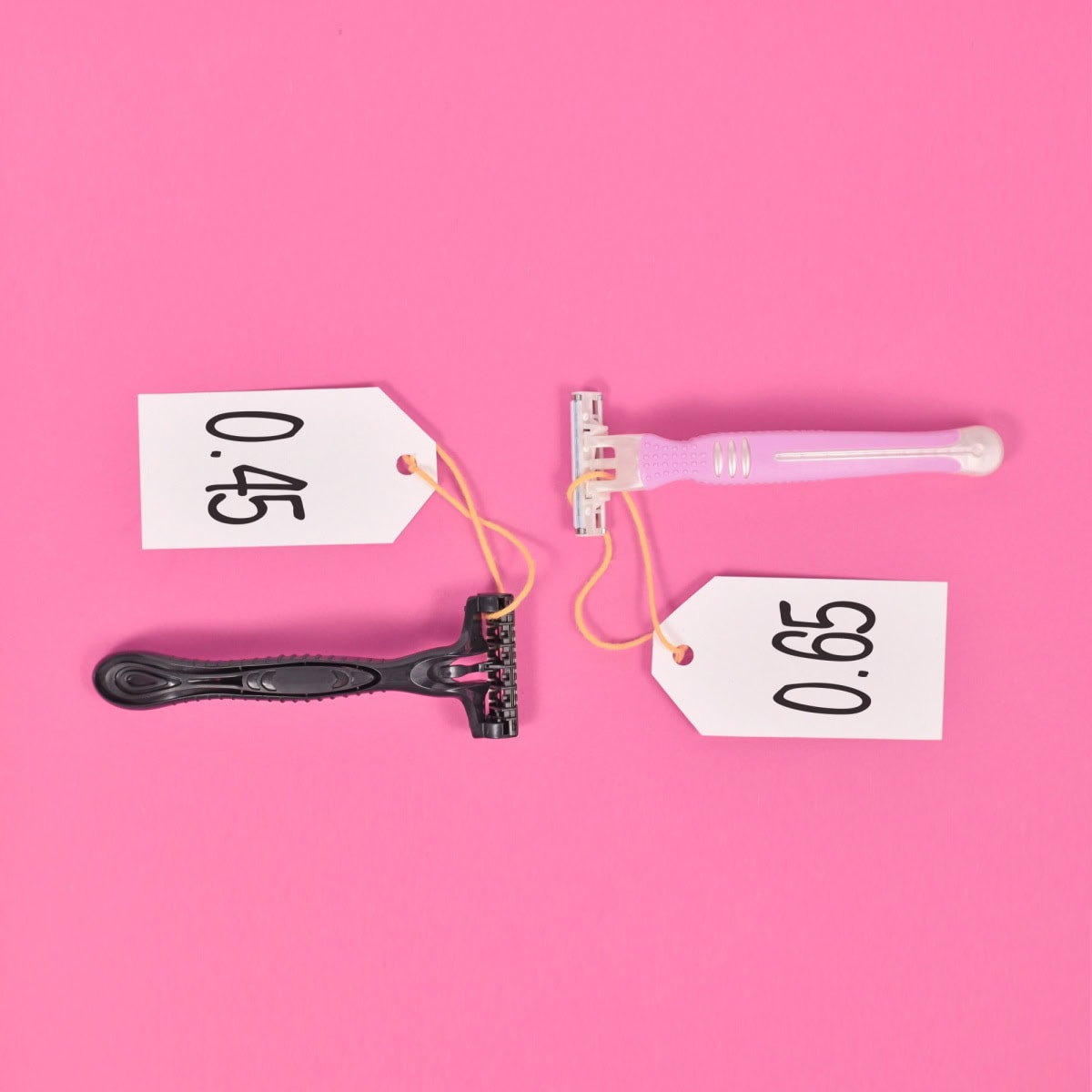 two razors are side by side with the black one costing $.45 and the pink one costing $.65.