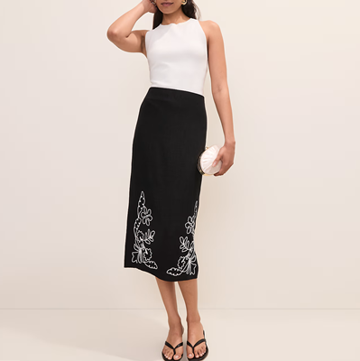 woman wears midi skirt with sleek tank