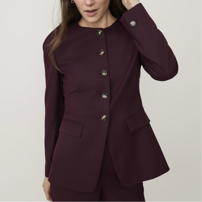 woman wears stylish cutaway collarless blazer