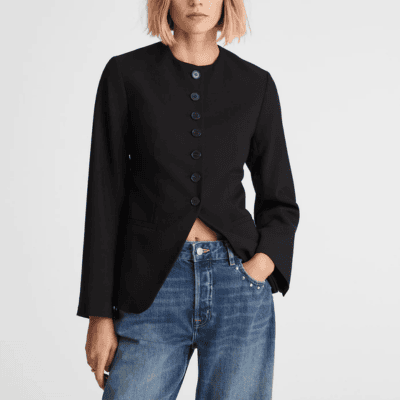 woman wears stylish cutaway collarless blazer