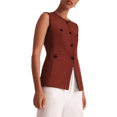 woman wears collarless  vest with cutaway bottom