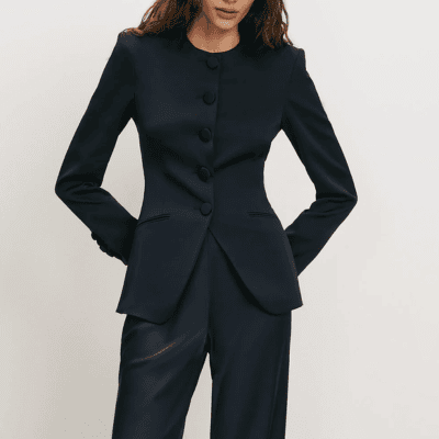 woman wears stylish cutaway collarless blazer