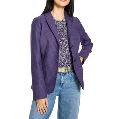 Tuesday's Workwear Report: Classic Shetland Blazer 44 A woman wearing blue jeans, a purple print top, purple blazer, and gold belt
