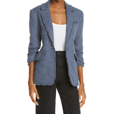 woman wears dusky blue blazer, white top, and black pants