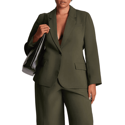plus-sized model wears olive green suit (without a bra, gasp)