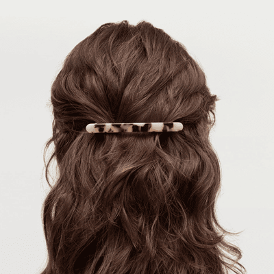 woman wears barrette in her hair